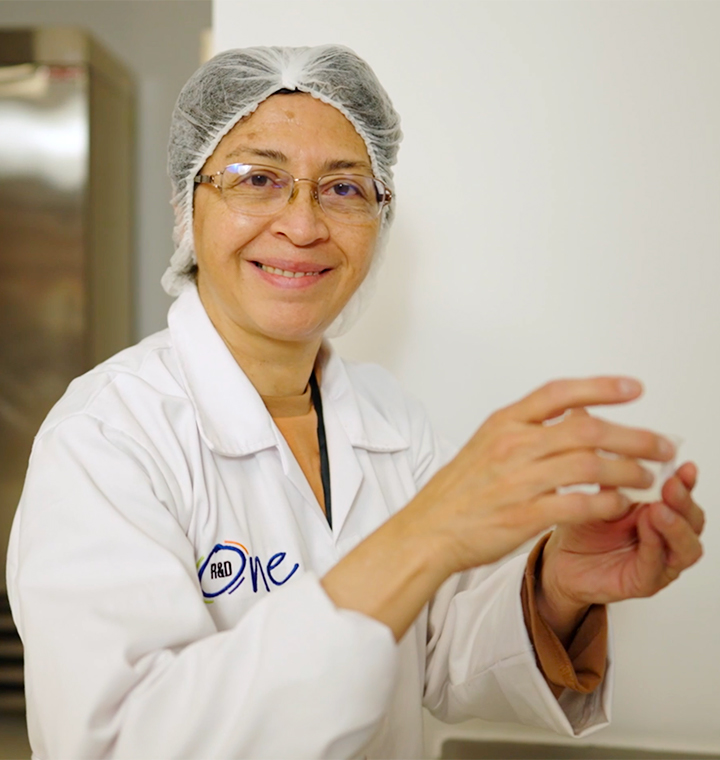 Female employee holding lab equipment