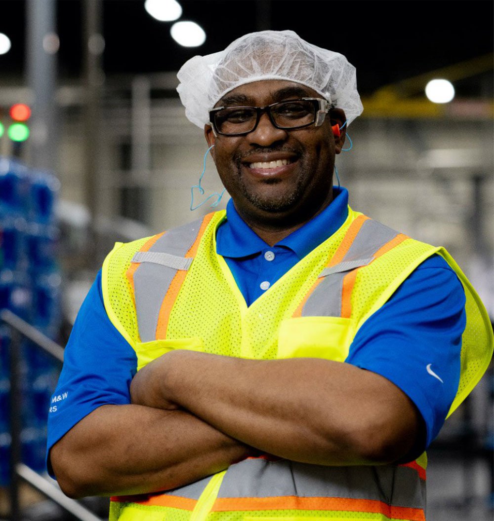 Employee standing in a manufacturing site